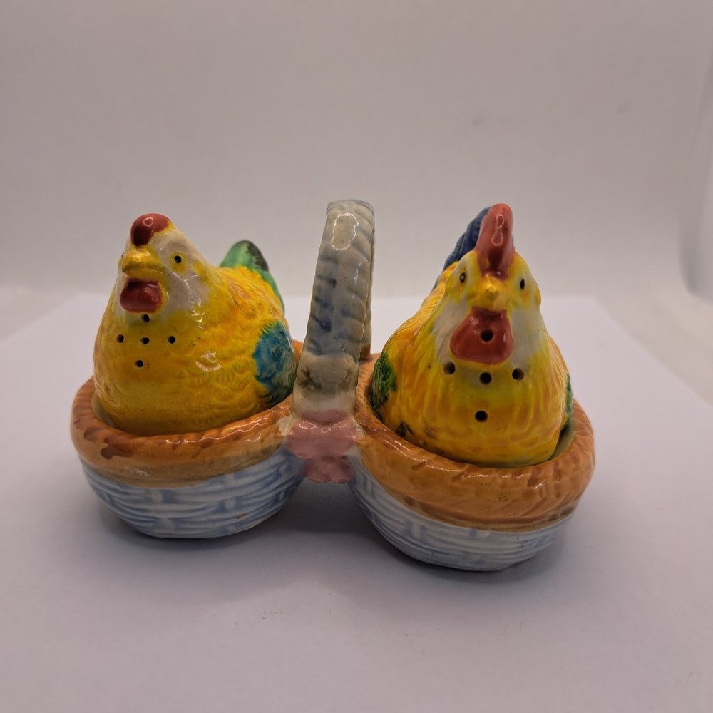 Vintage chicken salt and pepper on carrying dish.